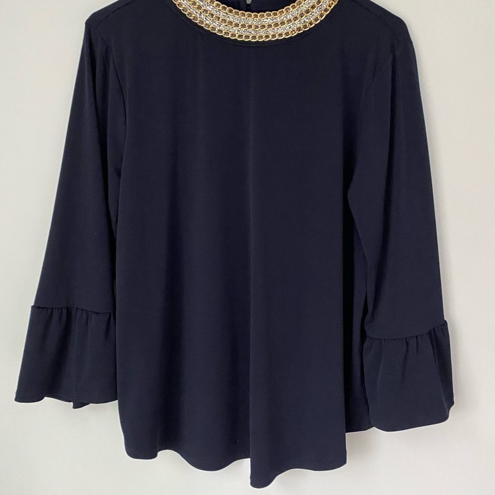 Elegant Black Top with Gold Accents